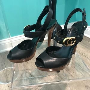 Black Gucci platforms with gold details. Size 7
